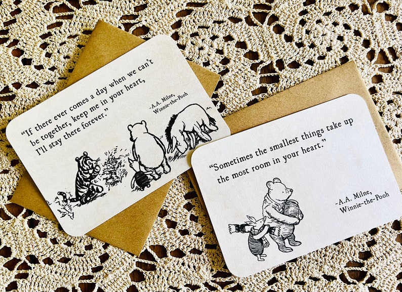 May include: Two Winnie-the-Pooh themed cards with black and white illustrations and quotes. The first card says "If there ever comes a day when we can't be together, keep me in your heart, I'll stay there forever." The second card says "Sometimes the smallest things take up the most room in your heart."