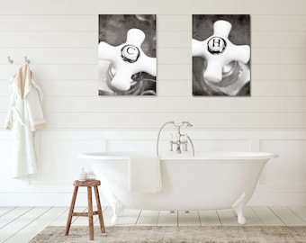 May include: Two black and white photographs of vintage bathroom faucets with the letters "C" and "H" on the handles.