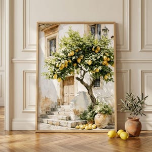 May include: Watercolour print of a lemon tree in front of a building with a stone staircase. The tree is laden with yellow lemons. The artwork is framed in a light brown wooden frame and rests on a wooden floor.