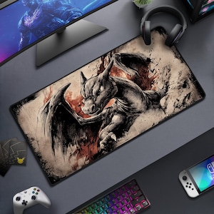 May include: A rectangular gaming mousepad featuring a black and gray illustration of a dragon-like creature with wings. The design has a distressed, vintage aesthetic with red and brown accents. The mousepad is surrounded by gaming accessories.