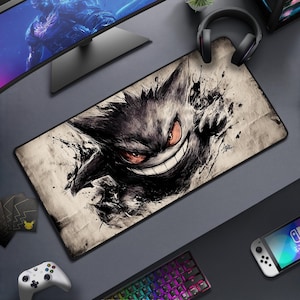 May include: A set of three ceramic mugs with a speckled, matte finish in cream, light grey, and dark grey. Each mug has a simple, minimalist design, suitable for coffee or tea.