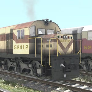 May include: Three diesel locomotives on parallel tracks under a blue sky. The lead locomotive is blue with yellow accents. The middle locomotive is tan and brown, displaying the number 52412. The third locomotive is white and red, with the number 52401.