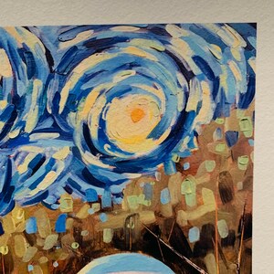 May include: A close-up of a painting in the style of Vincent van Gogh's "Starry Night". The painting features swirling blue and yellow brushstrokes, depicting a night sky with stars.