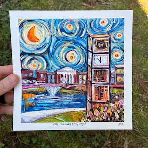 May include: An oil painting of a university campus at night, featuring a clock tower and buildings under a swirling, starry sky. The artwork uses vibrant blues, oranges, and yellows, with visible brushstrokes. The painting is signed in the lower right corner.
