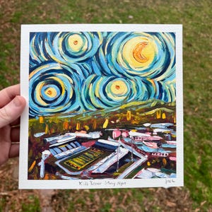 May include: A painting of a football stadium at night with a starry sky above. The sky is painted in a swirling blue and yellow pattern with a large yellow moon and several smaller yellow stars. The stadium is painted in shades of brown, pink, and white. The painting is titled "Kidd Brewer Starry Night".