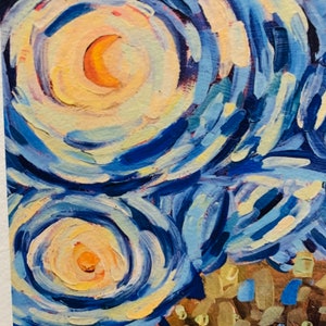 May include: A close-up of a painting in the style of Vincent van Gogh, featuring swirling blue, yellow, and white brushstrokes. The painting depicts a night sky with stars and a crescent moon.
