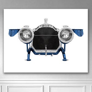 May include: A vintage car front view art print. The artwork features a detailed illustration of a classic car's front, with chrome and blue accents. The headlights are prominent, and the radiator grille is black.