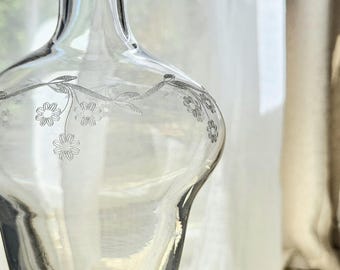 Vintage glass carafe engraved with flowers