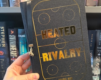 Heated Rivalry by Rachel Reid Hardcover Rebound Book