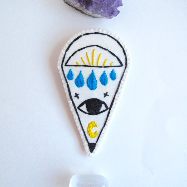 Hand embroidered brooch mystic eye with moon on bright cream organic muslin and cream felt backing summer trends An Astrid Endeavor