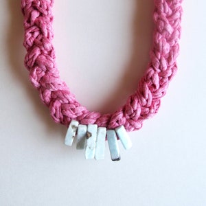 Textile necklace hand knotted using triple cotton cording braided together with light blue larimar gemstone spears focal point