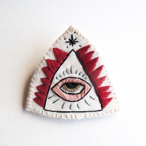 Mystic eye brooch hand embroidered on cream muslin with cream felt backing modern embroidery An Astrid Endeavor gifts for her unique jewelry