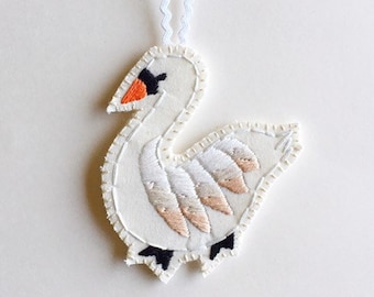 Christmas swan ornament hand embroidered on cream muslin with felt backing An Astrid Endeavor holiday home decor heirloom gift guide