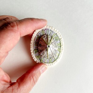 Hand embroidered brooch abstract design using lavender and green variegated threads and limpet shell An Astrid Endeavor fiber jewelry image 7