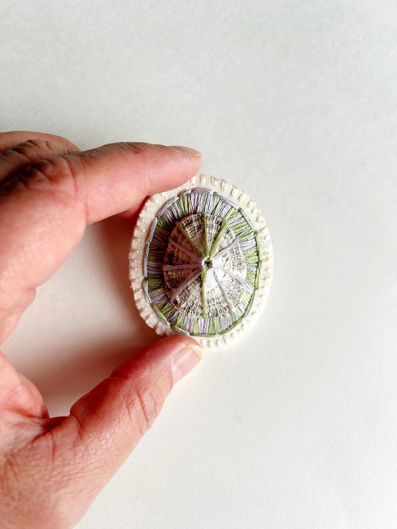 Hand embroidered brooch abstract design using lavender and green variegated threads and limpet shell An Astrid Endeavor fiber jewelry image 7