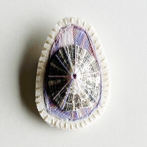 Hand embroidered brooch abstract design using lavender variegated threads and limpet shell An Astrid Endeavor contemporary fiber jewelry image 1