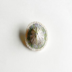 Hand embroidered brooch abstract design using lavender and green variegated threads and limpet shell An Astrid Endeavor fiber jewelry image 2