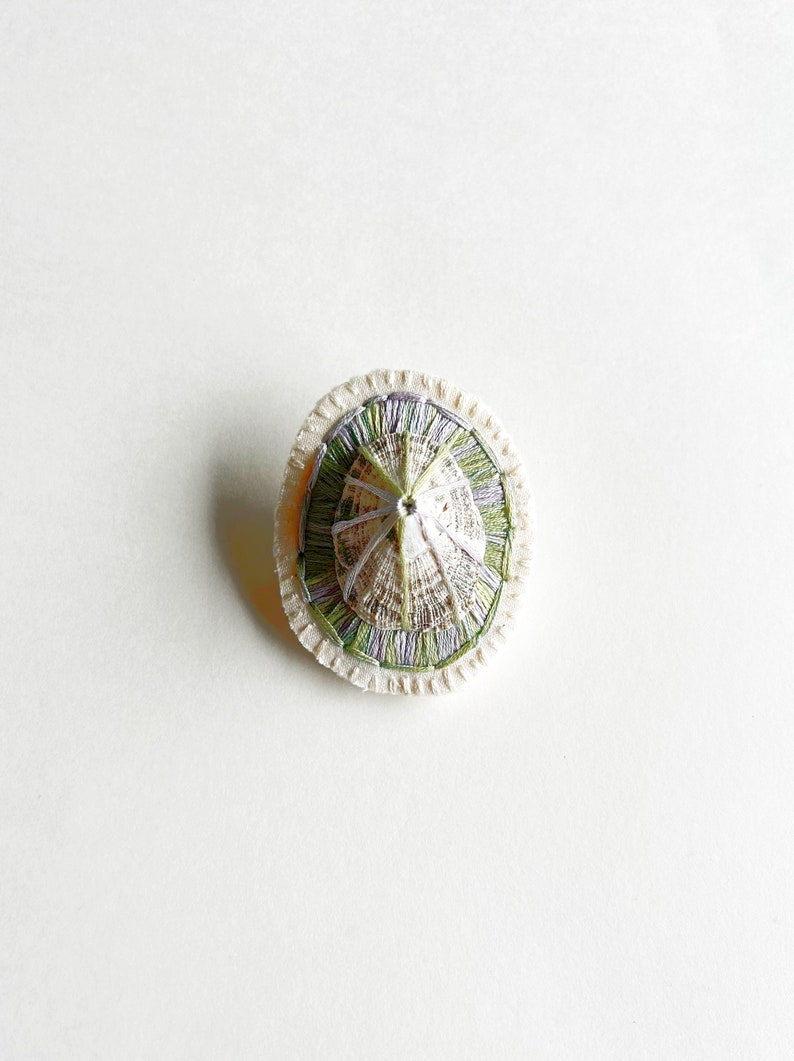 Hand embroidered brooch abstract design using lavender and green variegated threads and limpet shell An Astrid Endeavor fiber jewelry image 2