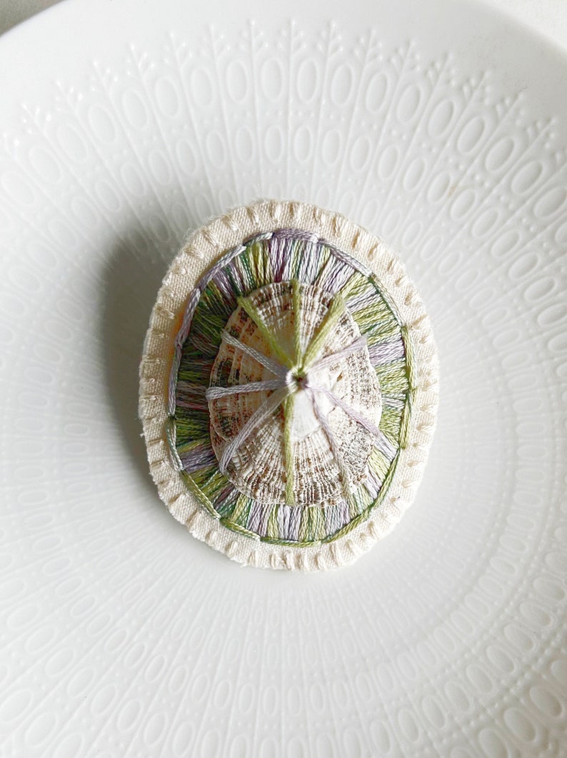 Hand embroidered brooch abstract design using lavender and green variegated threads and limpet shell An Astrid Endeavor fiber jewelry image 6