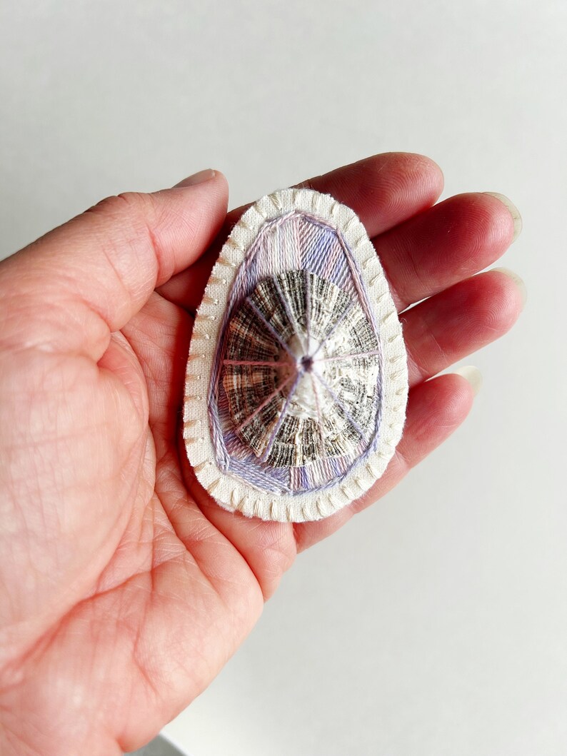 Hand embroidered brooch abstract design using lavender variegated threads and limpet shell An Astrid Endeavor contemporary fiber jewelry image 6