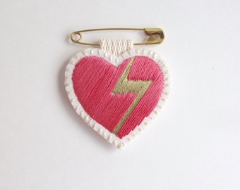 Embroidered heart brooch on bright cream muslin with gold lightning bolt and hot pink on a gold tone safety pin Valentines day gift