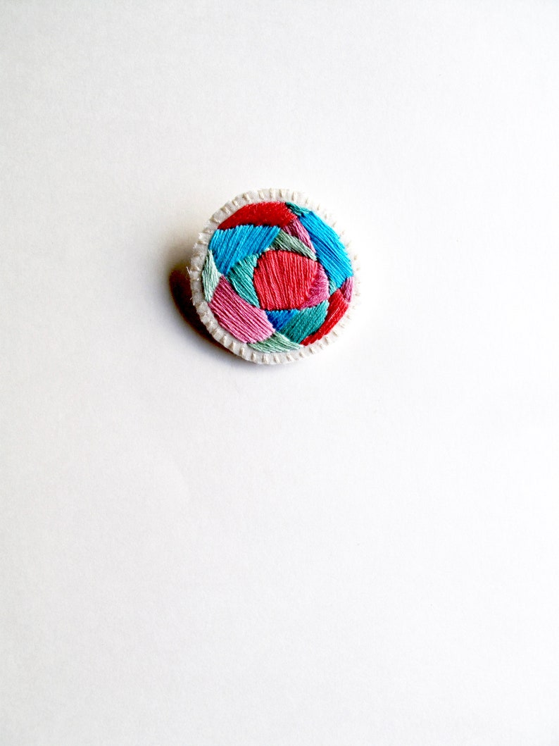 Hand embroidered brooch with round geometric design in bright pinks, blues and green colors on cream muslin Fall fashion An Astrid Endeavor image 2