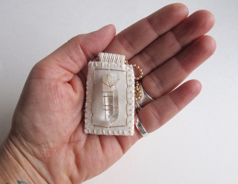 Quartz Crystal talisman fiber necklace hand embroidered with gold on cream muslin with a matte gold ball chain An Astrid Endeavor image 4