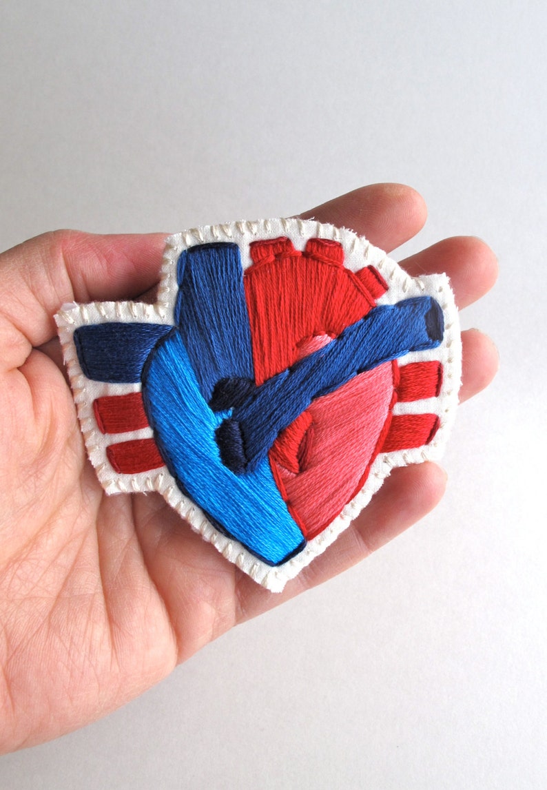 Anatomical heart brooch hand embroidered with reds and blue on Etsy
