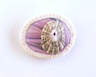 Hand embroidered brooch abstract design using lavender variegated threads limpet shell An Astrid Endeavor contemporary fiber jewelry