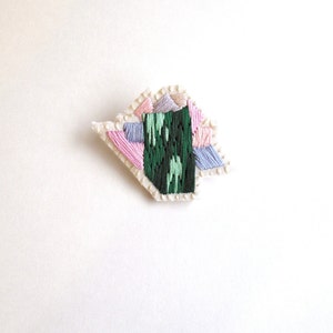 Abstract mineral brooch gem inspiration hand embroidered in ombre green with pink and lavender thread on cream muslin and cream felt