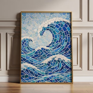 May include: A rectangular wall art piece in a thin gold frame featuring a mosaic design of ocean waves. The artwork uses various shades of blue, teal, and white tiles to depict crashing waves against a light blue sky, creating a textured surface.