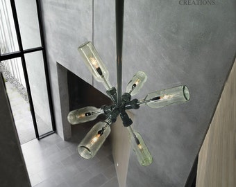 Starburst Chandelier. Wine / Beer bottles, plumbing pipe and fittings.