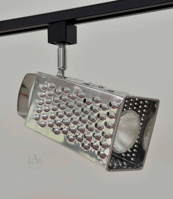 Grater Track Light Fixture. 3 Track lights and Track. Spot light. Grater Track Light Fixture. 3 Track lights and Track. Spot light.