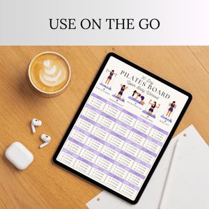 May include: A digital tablet displaying a 30 Day Pilates Board Upper Body Workout chart with exercise illustrations and a schedule. The screen shows text including USE ON THE GO, 30 Day Pilates Board, and Upper Body Workout with various reps.