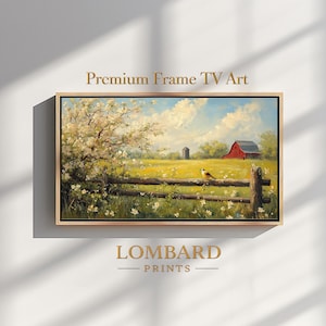 Puede incluir: Pintura de paisaje enmarcada con una escena rural: un granero rojo, una valla de madera y un pájaro. La obra de arte tiene un marco dorado y el texto "Premium Frame TV Art" y "LOMBARD PRINTS".
