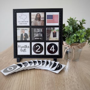 May include: A black square frame with a grid of nine tiles featuring images and text including a map of Texas, a portrait of Jesus, the American flag, a person in a suit, the text Elder Smith Moroni 7:31, and tiles displaying Months left 24.