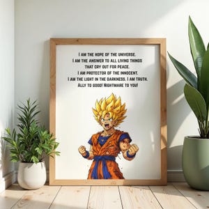 May include: A framed print with a colourful illustration of a character with spiky yellow hair and an orange and blue outfit. The print includes text: "I AM THE HOPE OF THE UNIVERSE...ALLY TO GOOD! NIGHTMARE TO YOU!" The frame is made of light-coloured wood.