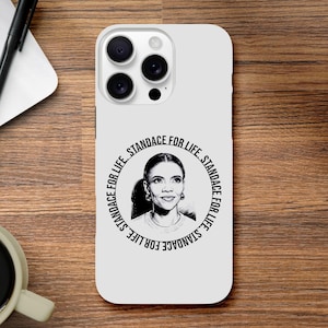 May include: White phone case featuring a black and white portrait of a woman with the text "CANDACE FOR LIFE" encircling the image. The phone case has a glossy finish and a camera cutout.