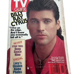 May include: A vintage TV Guide magazine cover featuring Billy Ray Cyrus. The cover has a red, white, and yellow color scheme with text that reads "TV Guide" and "Billy Ray Cyrus." The magazine also includes text about "Star Trek: Deep Space Nine."