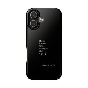 May include: Black phone case with a glossy finish. The case features a quote in white text: "She is clothed with strength and dignity" followed by "Proverbs 31:25". The phone case has a dual-lens camera.