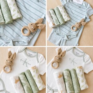May include: Four-panel image of baby clothing sets. Each set includes a short-sleeved bodysuit with the Calvin Klein logo, a crocheted bunny ring, and three muslin cloths with botanical prints. The bodysuits are either white or light blue striped.