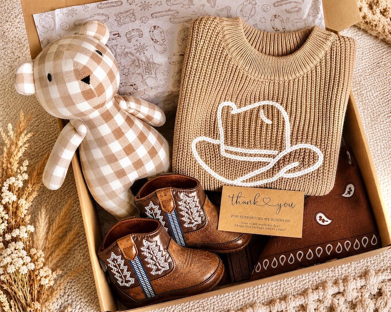 Western baby boy gifts. Baby Cowboy Boots giftset. Baby cowboy boots and hat. Baby western boots. Baby cowboy outfit. Baby western outfit. Baby cowboy sweater. Cowboy baby shower giftset. Cowboy themed baby giftset. Baby boy cowboy boots gift. Baby girl cowgirl gift. Texas cowgirl baby gift. Texas baby boy gift. Western themed nursery gift and decor. Country loving newborn baby gift. baby first rodeo. botas de vaquero. Infant baby gift set less than 50 dollars. Affordable baby gift set.