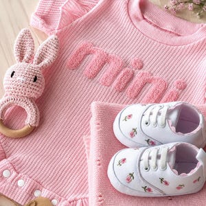 pink baby girl gifts. pink baby blanket. baby clothes. baby shoes sneakers. baby girl shoes. baby shower gift girl. baby announcement accessories. baby girl clothes gift set. baby girl ruffled romper gift. baby girl baby gift. princess baby gift. Chanel baby gift. embroidered baby shoes. floral baby gift.
