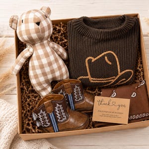 Western baby boy gifts. Baby Cowboy Boots giftset. Baby cowboy boots and hat. Baby western boots. Baby cowboy outfit. Baby western outfit. Baby cowboy sweater. Cowboy baby shower giftset. Cowboy themed baby giftset. Baby boy cowboy boots gift. Baby girl cowgirl gift. Texas cowgirl baby gift. Texas baby boy gift. Western themed nursery gift and decor. Country loving newborn baby gift. baby first rodeo. botas de vaquero. Infant baby gift set less than 50 dollars.