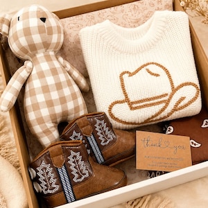 Western baby boy gifts. Baby Cowboy Boots giftset. Baby cowboy boots and hat. Baby western boots. Baby cowboy outfit. Baby western outfit. Baby cowboy sweater. Cowboy baby shower giftset. Cowboy themed baby giftset. Baby boy cowboy boots gift. Baby girl cowgirl gift. Texas cowgirl baby gift. Texas baby boy gift. Western themed nursery gift and decor. Country loving newborn baby gift. baby first rodeo. botas de vaquero. Infant baby gift set less than 50 dollars. Affordable baby gift set