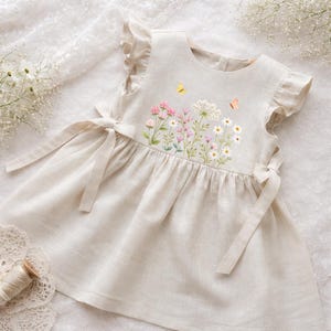 May include: A set of three ceramic mugs with a speckled, matte finish. The mugs are in shades of cream, light grey, and dark grey. Each mug has a simple, minimalist design, ideal for coffee or tea.