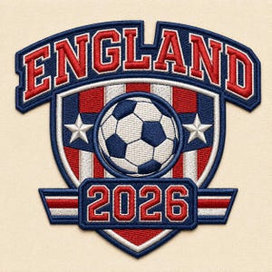 May include: An embroidered patch featuring the word ENGLAND in red letters on a blue arched banner. Below, a shield displays a soccer ball, two white stars, and red and white vertical stripes. A blue rectangular banner at the bottom reads 2026.