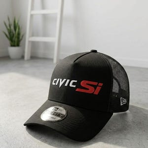 May include: Black Civic Si baseball cap with a mesh back and a curved brim. The front features the text "CIVIC Si" in white and red. A small, round sticker is on the brim.