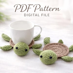 May include: Two crocheted turtle coasters with green flippers and heads, and tan shells. A white mug sits behind one coaster. The text "PDF Pattern DIGITAL FILE" is at the top of the image.