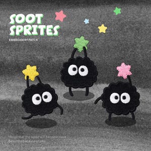 May include: Three black Soot Sprite embroidery patches with white eyes and star-shaped accents in yellow, green, and pink. The text "SOOT SPRITES EMBROIDERY PATCH" is at the top, with the phrase "I hope that the world will become more beautiful because of you" at the bottom.
